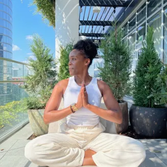 TRILUNA co-founder, Ashley Brooke James, leads a meditation for the guests of a hotel client.