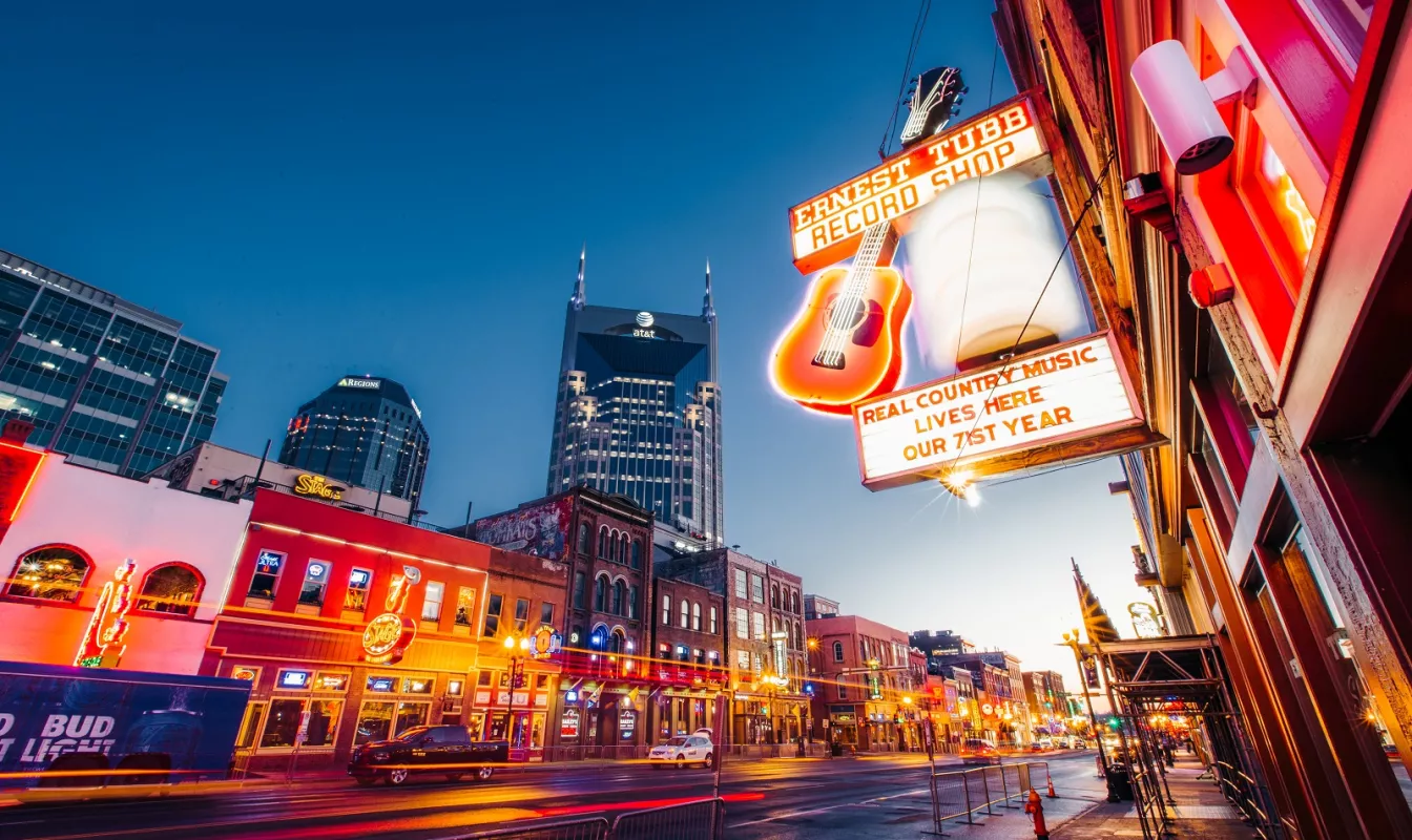 Nashville's Broadway lined with neon lights in the evening