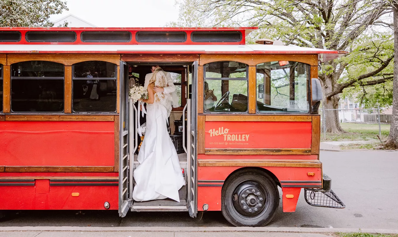 Bride and Groom on Trolley at Wedding