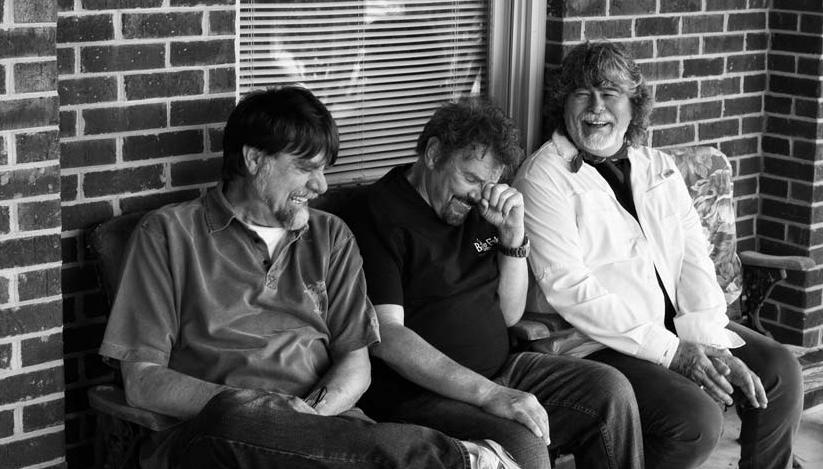 Members of country group Alabama laughing