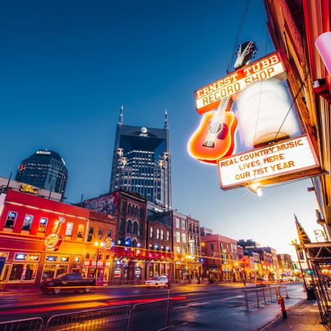 Nashville's Broadway lined with neon lights in the evening