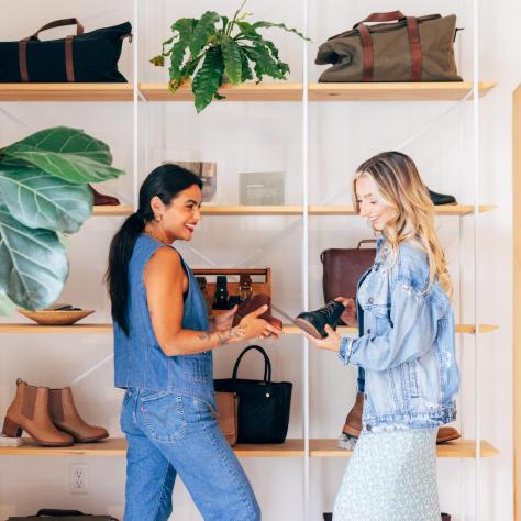 Two woman shop for handbags in Nashville