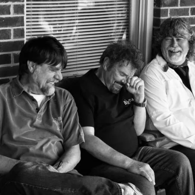 Members of country group Alabama laughing