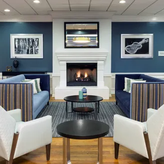 Hotel lobby with modern seating and fireplace