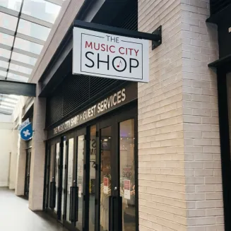 Exterior view of The Music City Shop entrance at Fifth and Broadway in Nashville