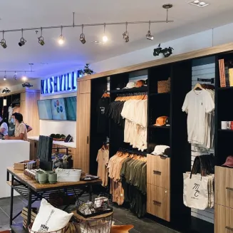 Interior of The Music City Shop with clothing and merchandise displays