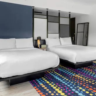 Enjoy our modern 2 queen loft style hotel rooms!