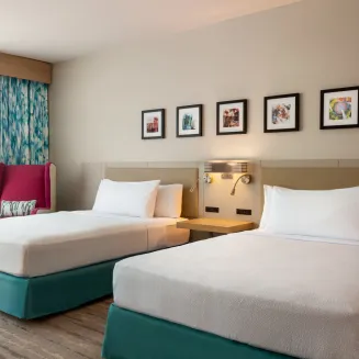 Experience unparalleled comfort for your family in our spacious room featuring two queen-sized beds. Designed with families in mind, our accommodations provide ample space to relax and unwind after a day of exploring downtown Nashville. Create cherished memories together and enjoy a peaceful night's rest in a room that caters perfectly to your family's needs.
