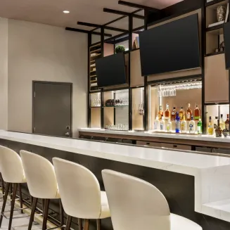 Unwind and indulge at our onsite bar, where happy hour drinks meet exceptional ambiance. Sip and savor your favorite beverages in style, surrounded by a welcoming atmosphere. Join us for a delightful happy hour experience that perfectly complements your stay.
