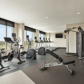 Recharge your energy in our fitness center, featuring floor-to-ceiling windows that frame inspiring panoramas. Engage in your workout routine while being motivated by the ever-changing and invigorating views that surround you. Our fitness center is designed to elevate both your physical and mental well-being, allowing you to sweat it out while soaking in the beauty of the world beyond.