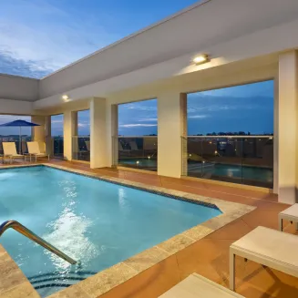 Elevate your stay with a visit to our rooftop pool – a tranquil oasis nestled above the bustling cityscape. Bask in the sun while enjoying refreshing dips in the inviting waters. Our rooftop pool offers a serene escape where you can relax and rejuvenate, all while taking in breathtaking views. Experience a slice of paradise high above the city at the Hilton Garden Inn Nashville West End's rooftop pool.