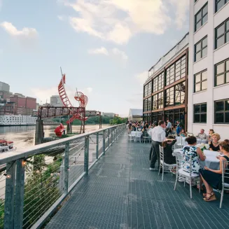Banquet dinner setup on the riverfront patio in downtown Nashville at the Bridge Building Event Spaces. Photo by Sara Bill Photography.