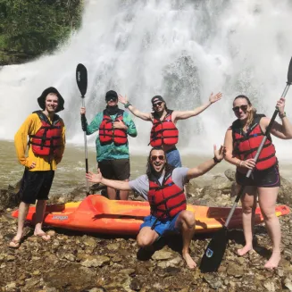Kayakers pose in front of Burgess Falls near Nashville, Tennessee.