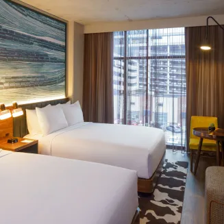Gaze out your floor-to-ceiling windows and dream about your Nashville day—you’ll have two double beds, a work table and a living area to enjoy in your hotel room after exploring our unique city and all it has to offer.