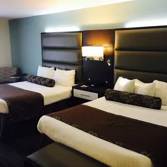 Two Queen beds with microwave and fridge