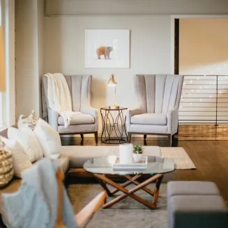 Small group meeting area elegantly designed with private restroom, wet bar, dining area, private suite and lounge.