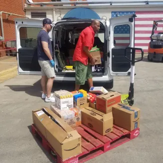 Distributing food to community partners from a food rescue pickup.