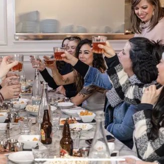Women on a Walk Eat Food Tour at a Nashville table.