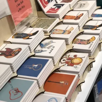 Stone coasters customized with Helen's original art.