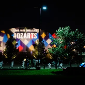 OZ Arts shines at night.