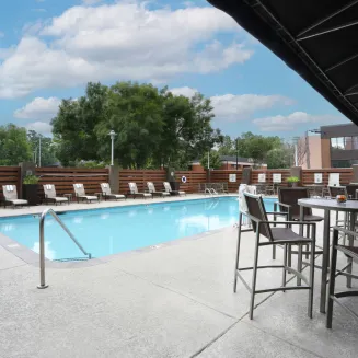 Hotel Guest enjoy our outdoor seasonal pool next to the fitness center.