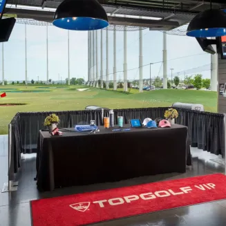 A table with amenities in the V.I.P. section of Topgolf Nashville in Nashville, TN.