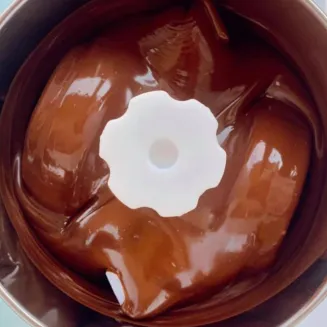 Grinding dark chocolate in a stone melanger to create smooth chocolate!