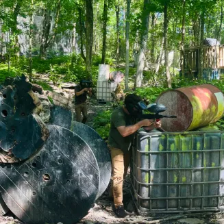 Players battling it out on Ambush Acres at Xtreme Paintball TN
