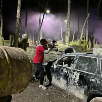 Player battles it out on Crash Site field during Night ball at Xtreme Paintball TN