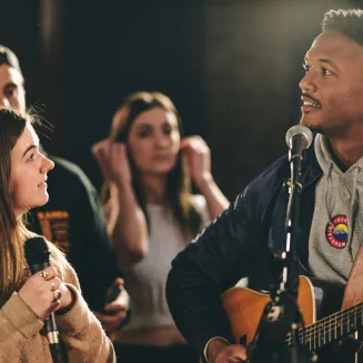 Singer songwriters preparing to perform original hooks written at Song House