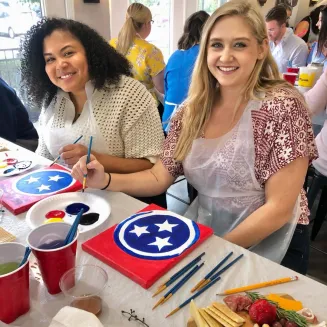Guests enjoying painting at Cheese Boards and Brushes Combo Event