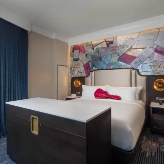 Step into one of our beautifully designed guest rooms that blend comfort, character, and a touch of southern hospitality. Enjoy breathtaking views of the city skyline and river with curated amenities including an in-room music experience and luxury linens to make every moment memorable.