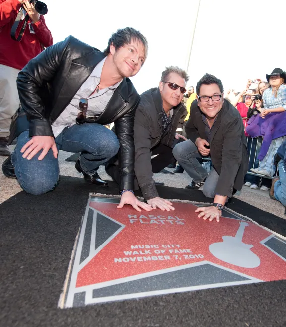 Rascal Flatts hands on star on Music City Walk of Fame