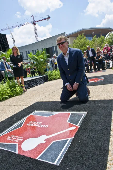 Steve WInwood with his star on the Music City Walk of Fame. 