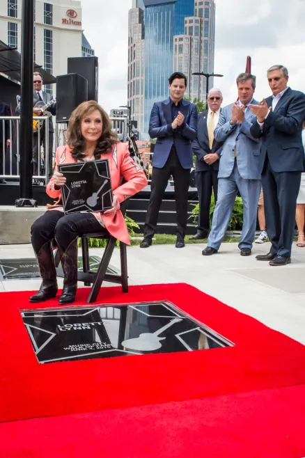 Loretta Lynn with her star on the Music City Walk of Fame