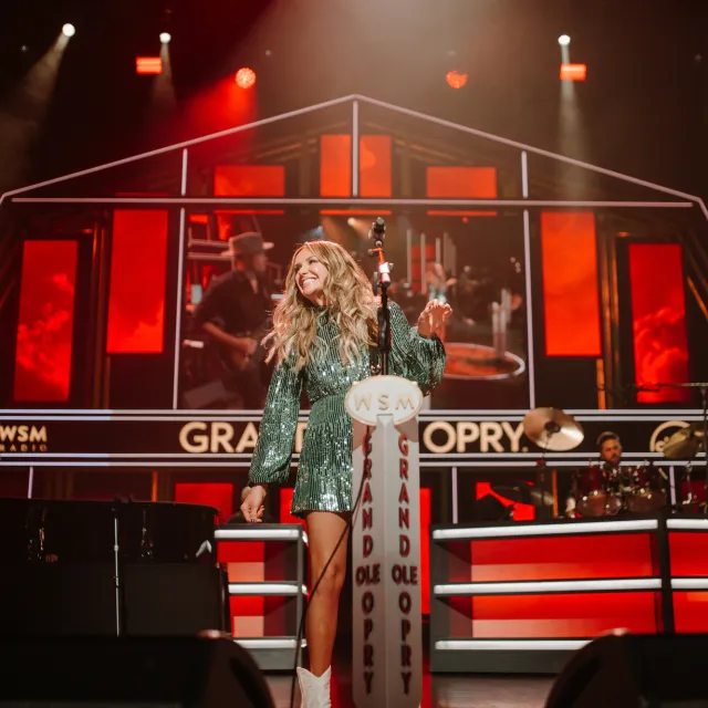Carly Pearce performing on stage at Grand Ole Opry.