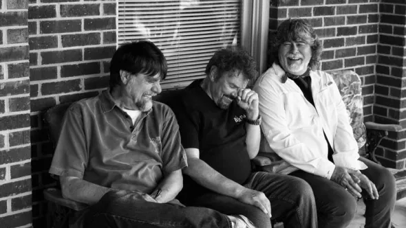 Members of country group Alabama laughing